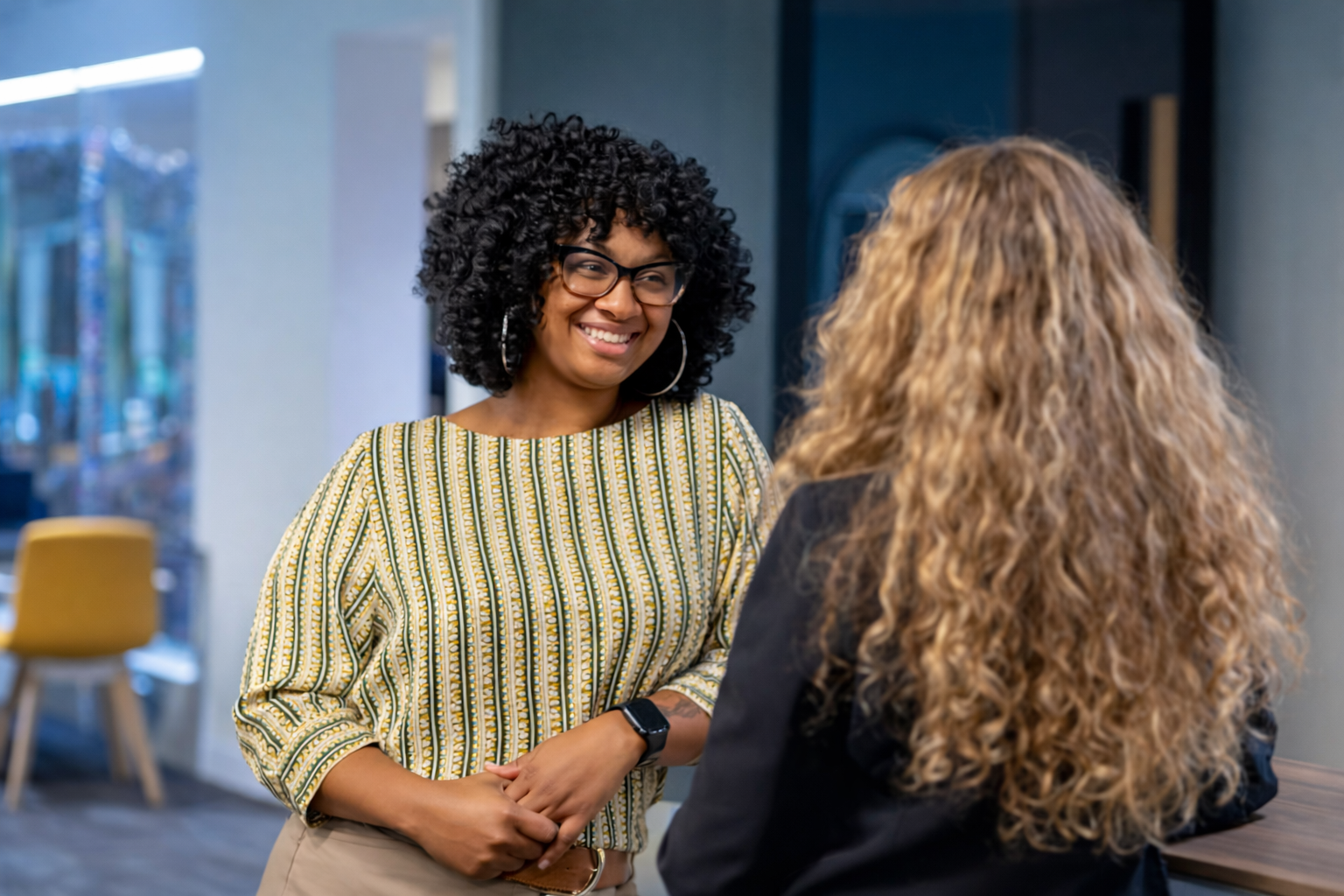 Two women talking in an office