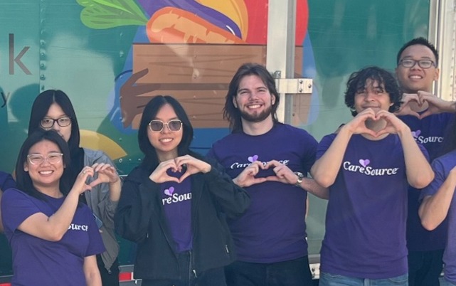 people making heart hands