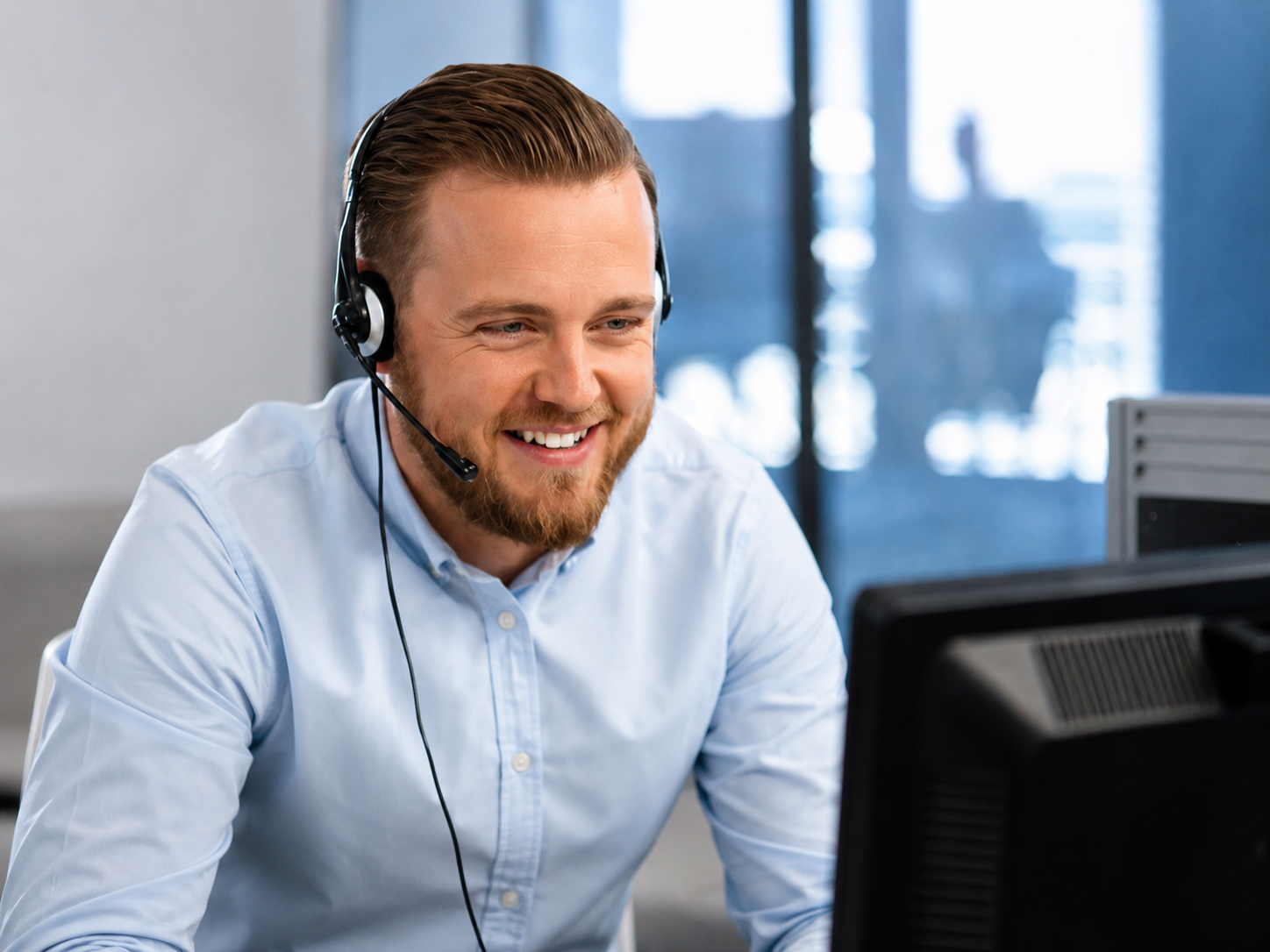 man smiling with headset