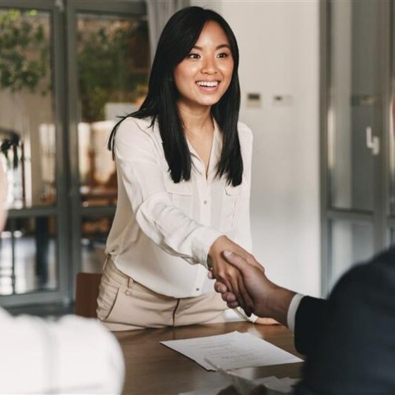 woman shaking hands with a person