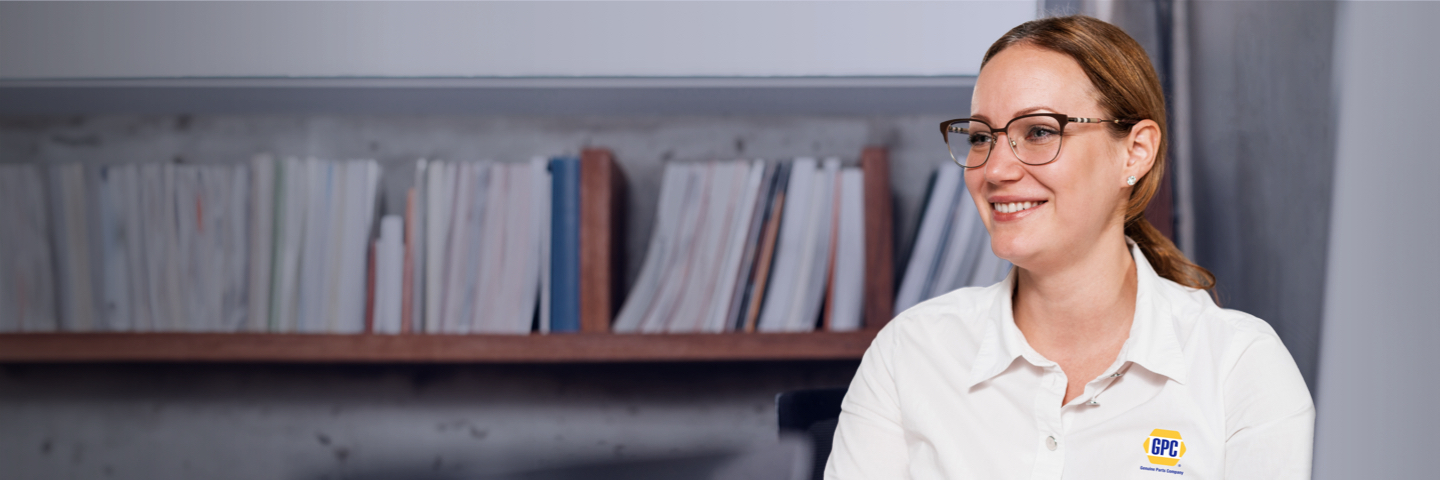 Woman sitting in office having a good time working