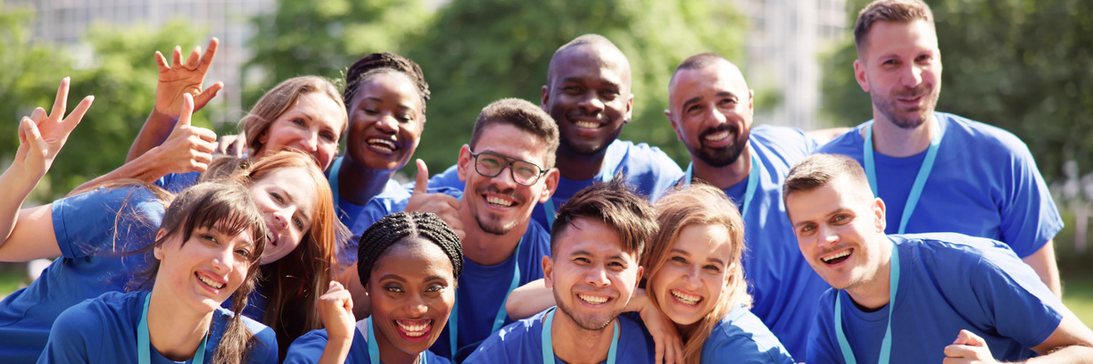 Group of smiling people on sunny day