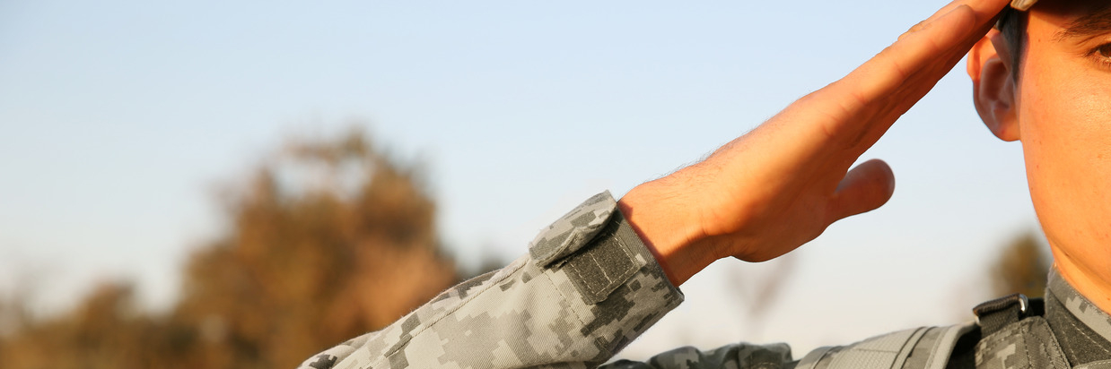 Soldier saluting on a sunny day
