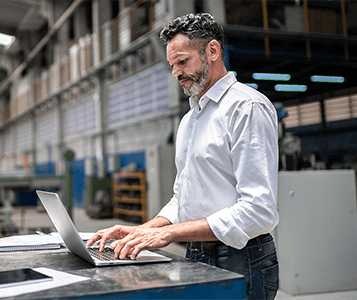 Man typing on a laptop