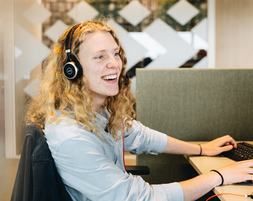 woman with headphones smiling