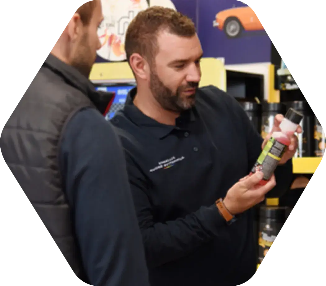 Alliance Automotive Group employee helping a customer