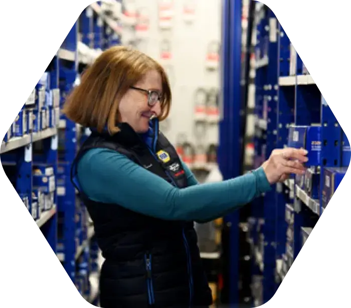 Alliance Automotive Group employee restocking shelves