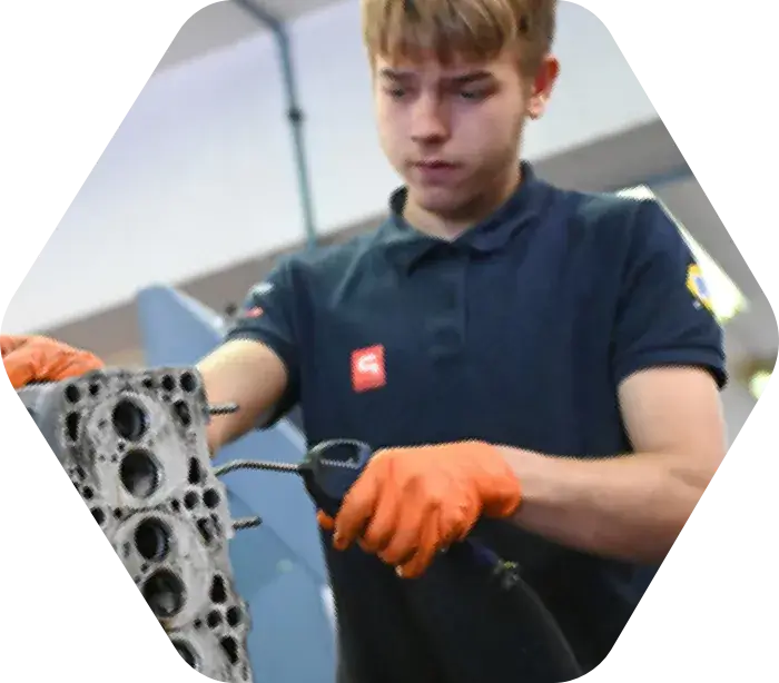 Alliance Automotive Group employee sundering an engine block