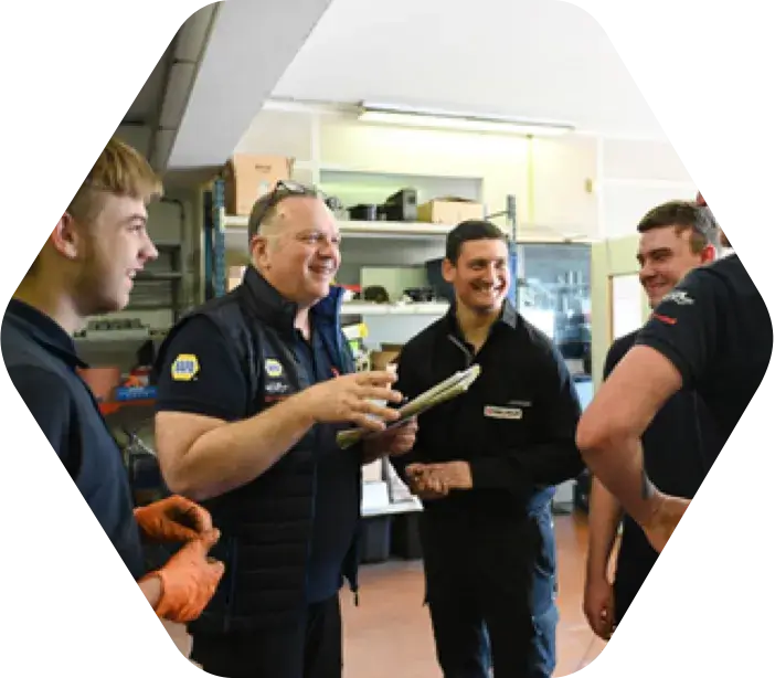 A group of employees talking with one another