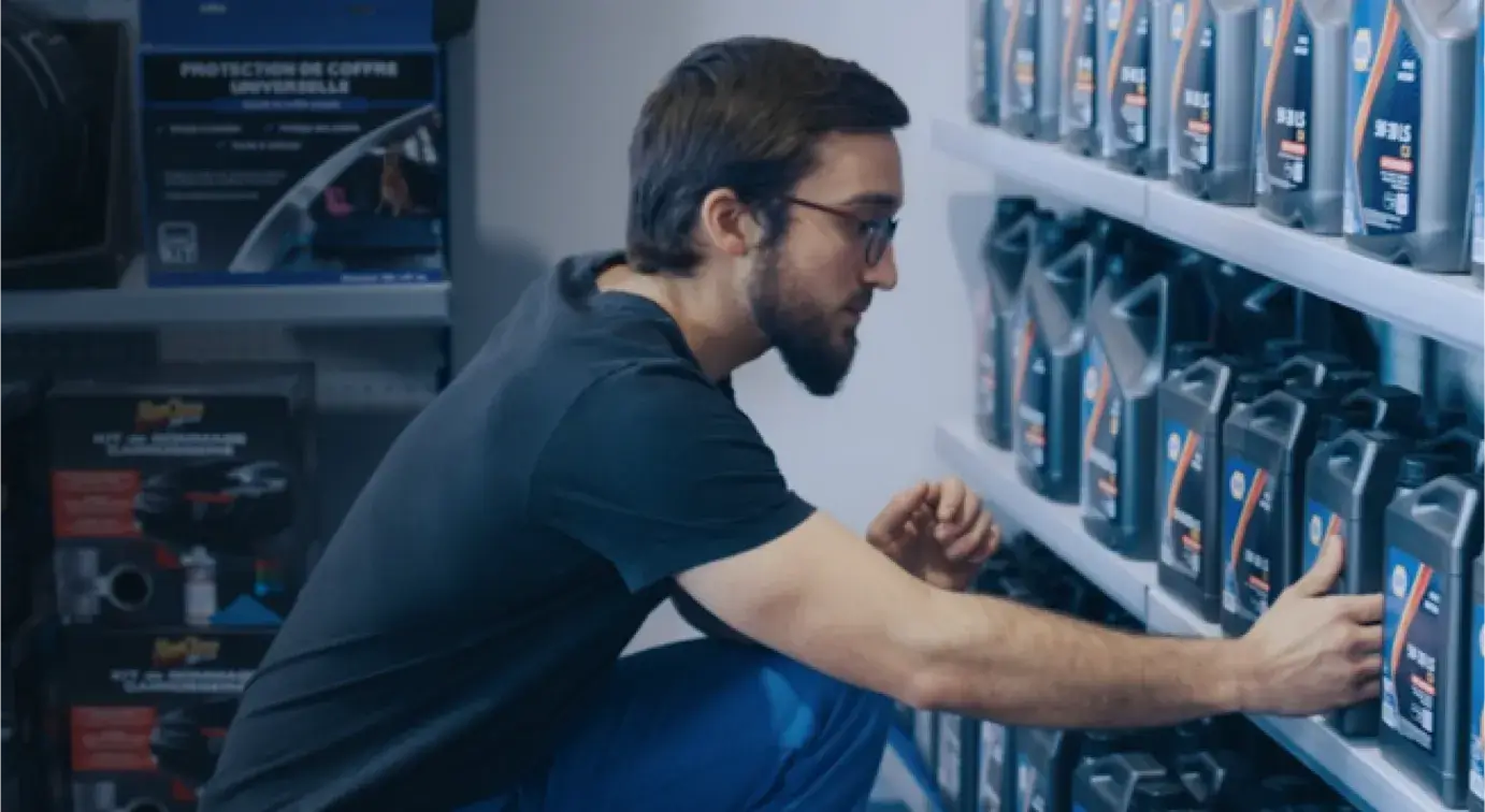 Man stocking oil at a GPC store