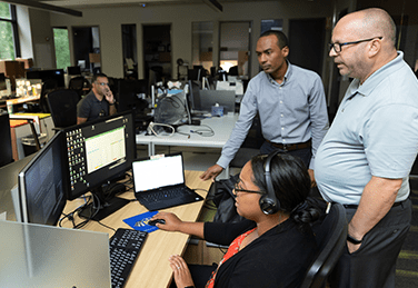 People staring at a computer screen