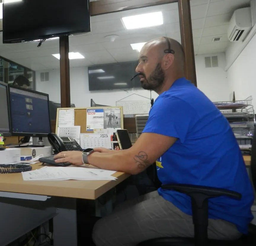 Man working inside the store with computer 