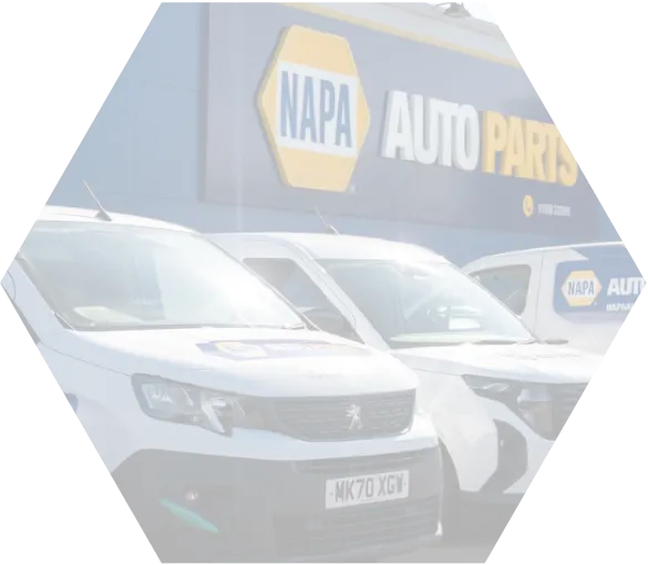 Cars parked outside the NAPA Auto parts Show Room