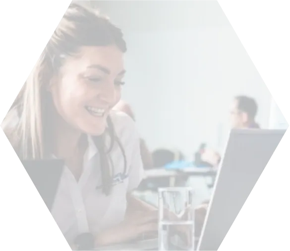 Women smiling while looking her laptop