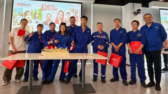 10 SCJ team members celebrating their birthday at team meeting