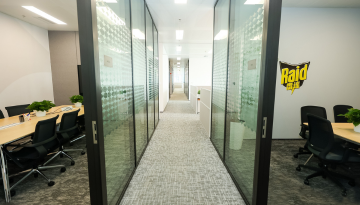 Hallway area with conference rooms - Raid logo on wall