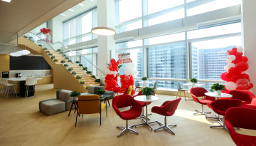 Seating area in lobby with staircase behind