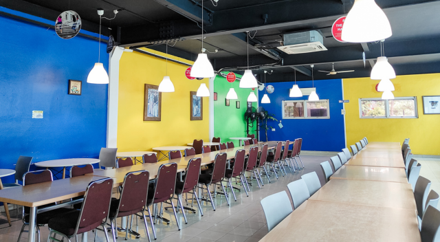 Canteen / cafeteria area with tables and chairs, colorful walls