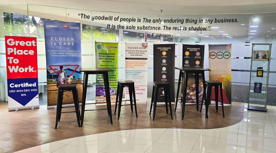 Lobby area with tables, chairs and SCJ display items