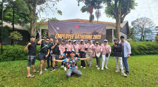 Group photo of Surabaya team at outdoor event