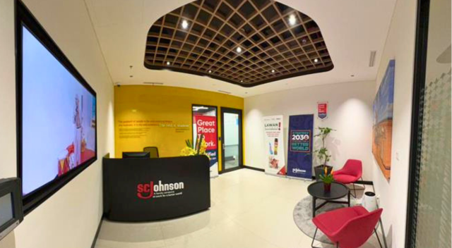 Front desk area of office with lobby seating