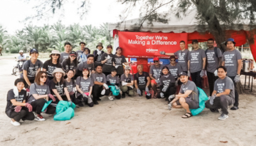 Team members from SCJ Malaysia posing for a group photo at a plastic waste clean up volunteering event