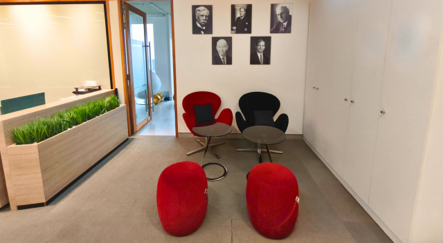 Seating area with SCJ founder images on wall