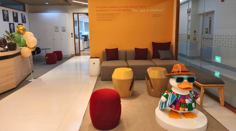 Seating area with SCJ mural in background