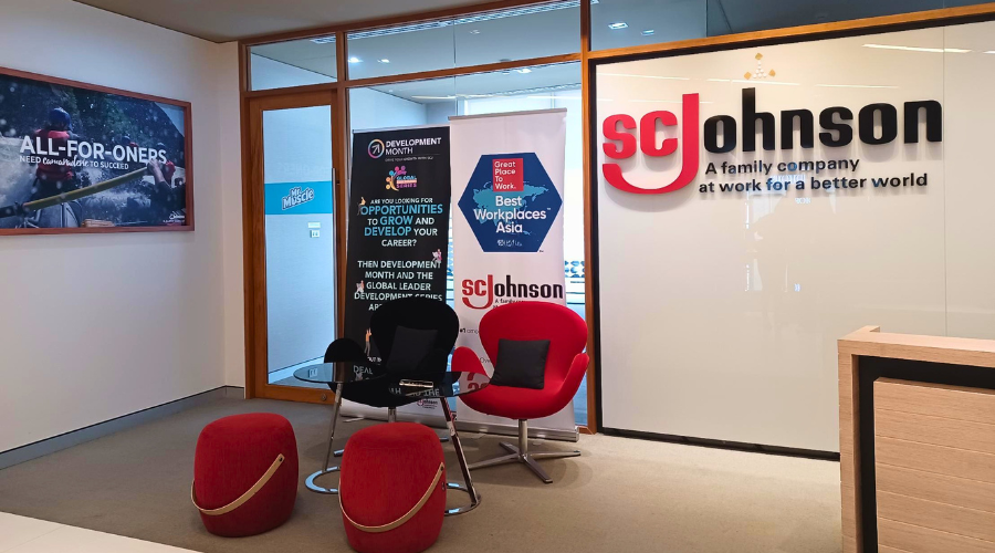 SCJ Thailand front desk area with chairs and large SCJ logo