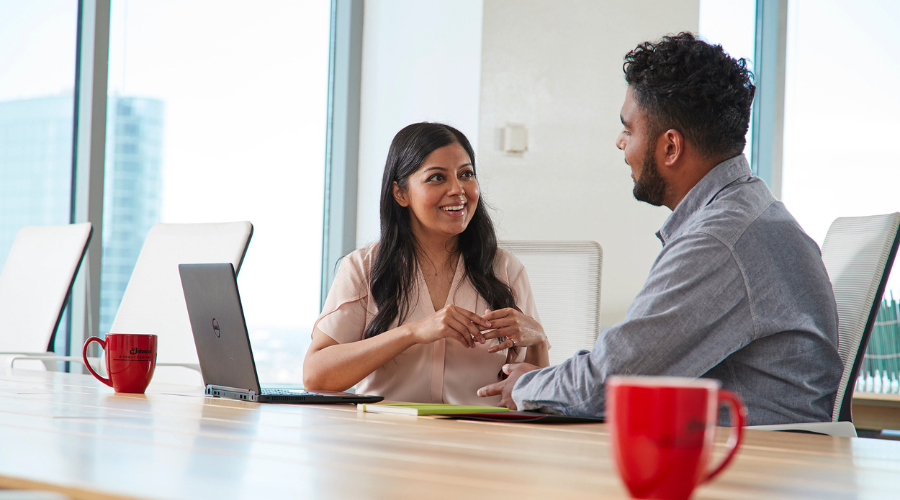 Two SCJ employees in discussion at a conference table