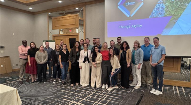 Group of SCJ team members pose for a group photo at a training session