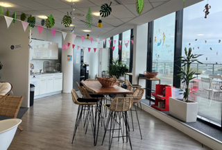 High top table in cafeteria area with panoramic view window