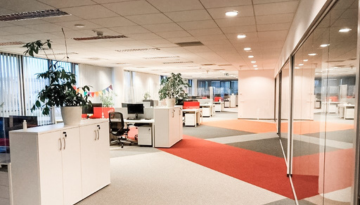 Photo of two desks in the vibrant and modern Warsaw office.