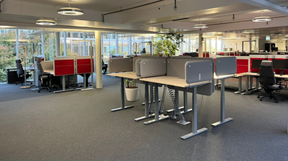 Interior of Switzerland office table with workspaces in background