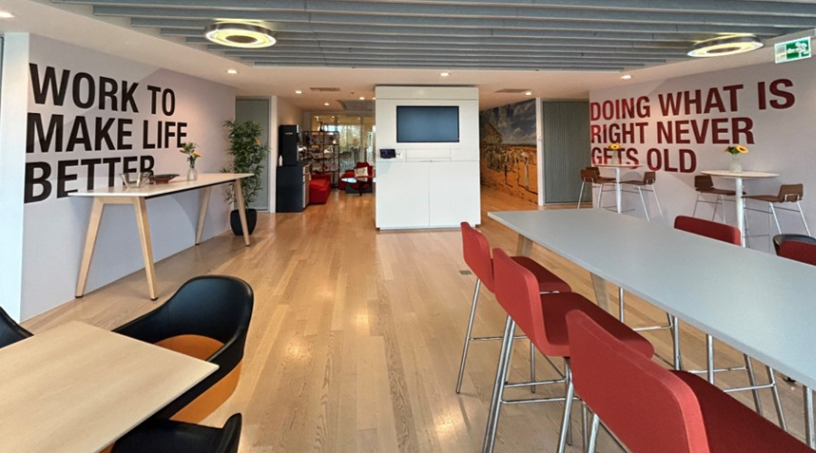 Interior of Rolle office tables and murals on the walls