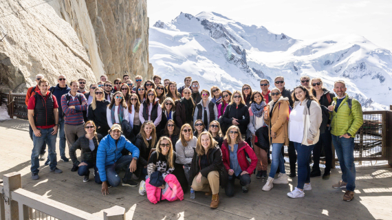 Switzerland team posed for group photo in front of mountains as backdrop