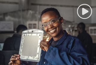 Woman holding SCJ Guardian product and smiling