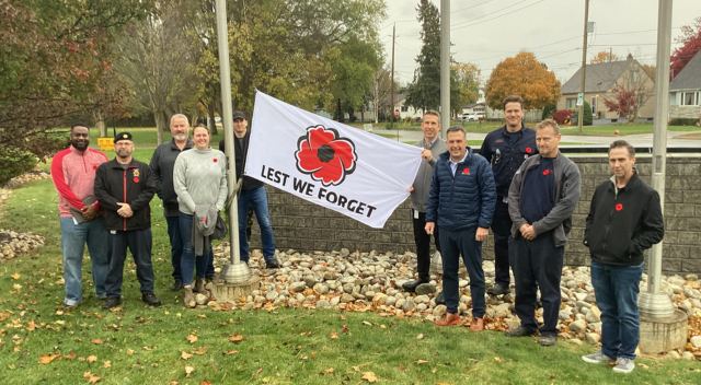 SCJ VALOR members posing with flag