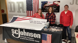 SCJ team members hosting Veterans Day table to show gratitude