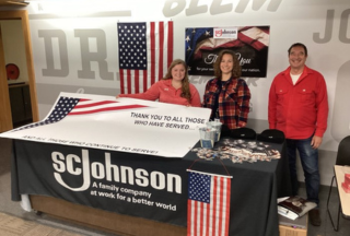 SCJ team members hosting Veterans Day table to show gratitude