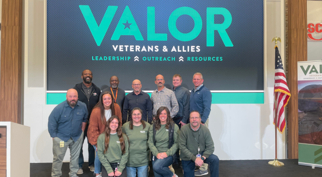 VALOR leadership posing for a group photo after speaker event