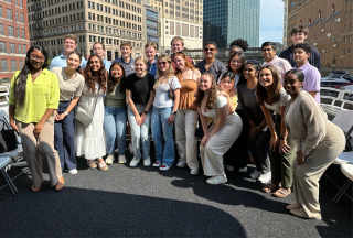 Group of SCJ interns on a boat tour together