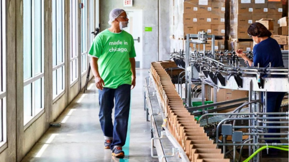 employee walking in the manufacturing plant