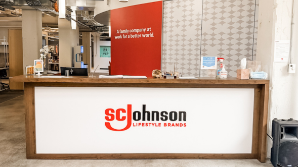 Front desk of LSB San Francisco office with logo on front of desk