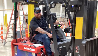 Team member at skills demonstration on forklift