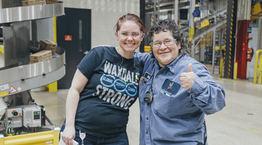 Two Waxdale team members giving thumbs up