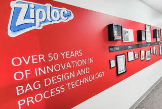 Wall display of Ziploc logo and history timeline