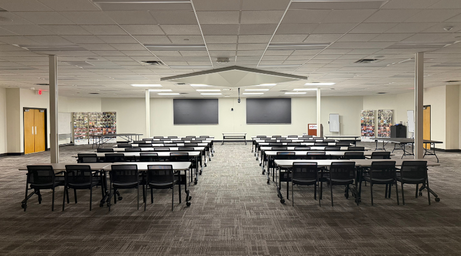 Interior of Louis Commons meeting room with tables and chairs