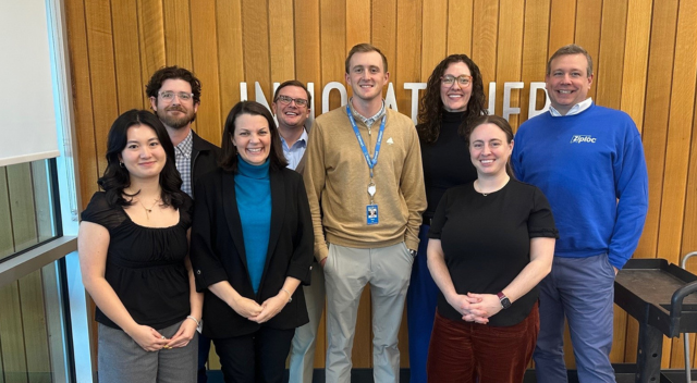 Eight SCJ team members posing for a team photo