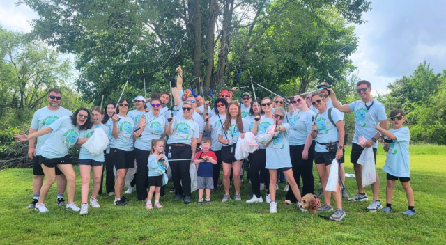Group photo of SCJ Rogers team at Earth Day cleanup event